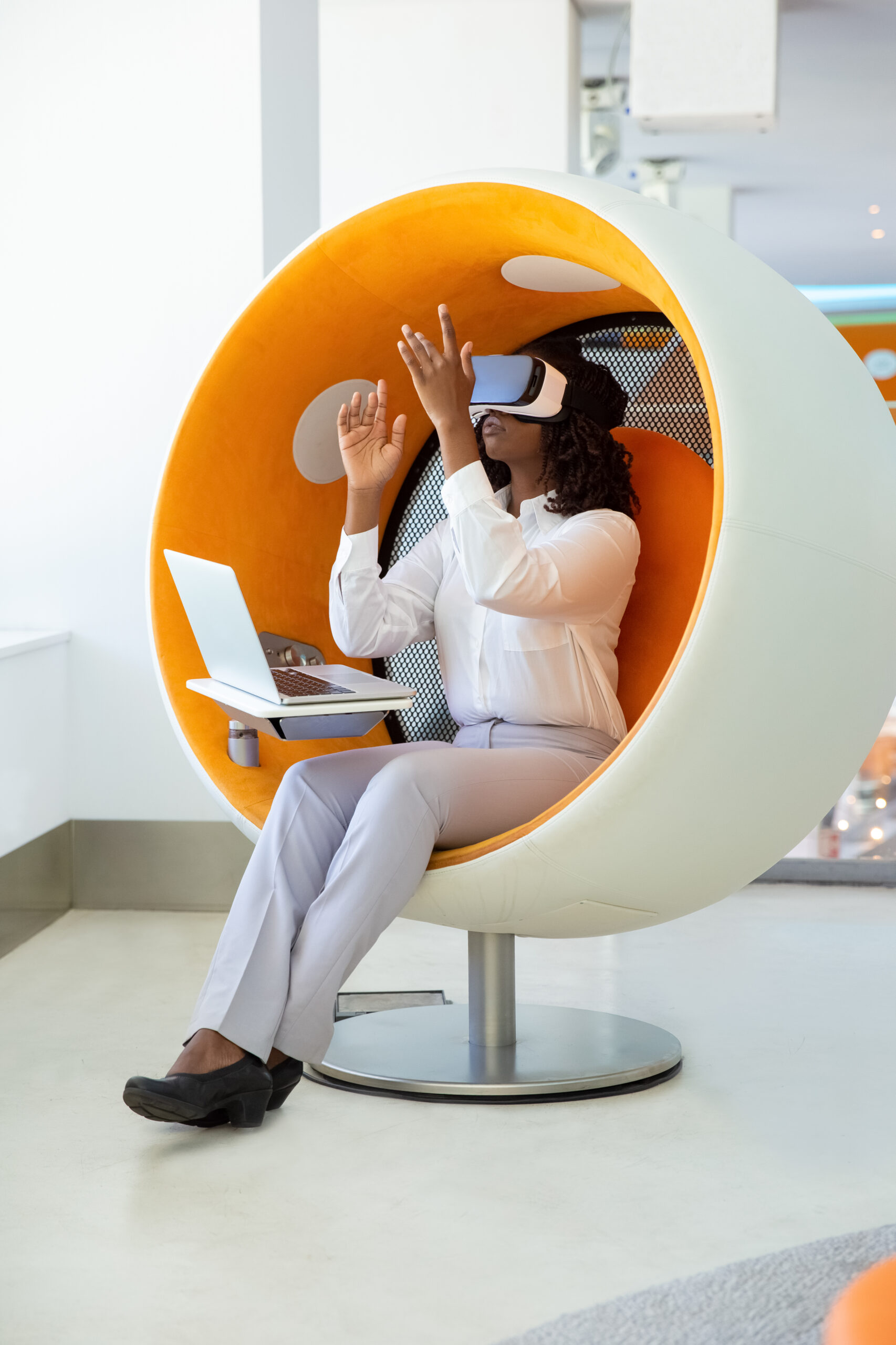 Focused woman testing VR headset. Thoughtful African American tester wearing virtual reality glasses. Technology concept